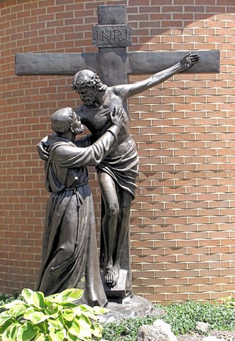 statue of St. Francis of Assisi holding the Crucified Christ on the Cross, Holy Spirit Friary, Franciscan University, Steubeville OH